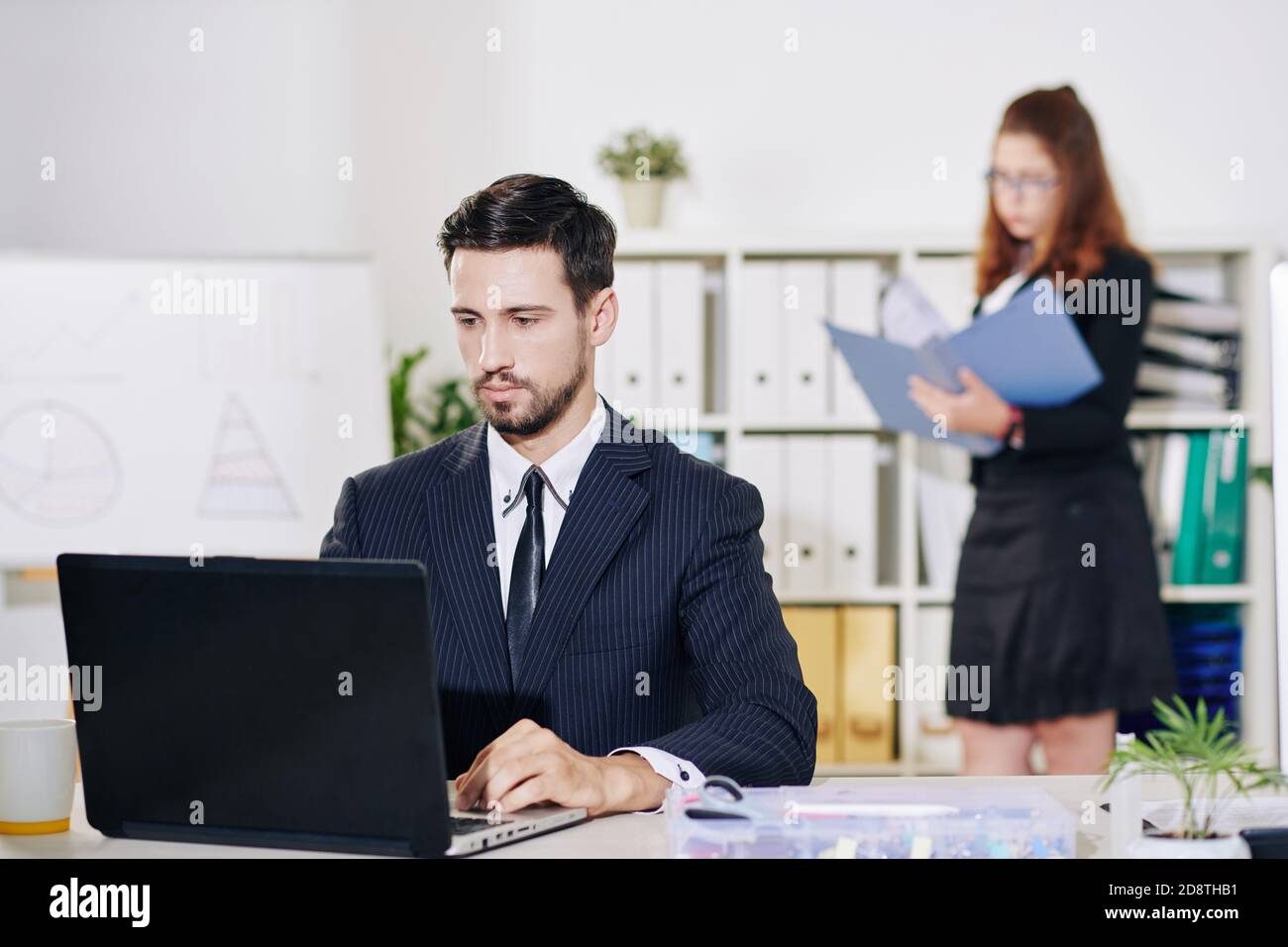 Entrepreneur working on laptop Stock Photo