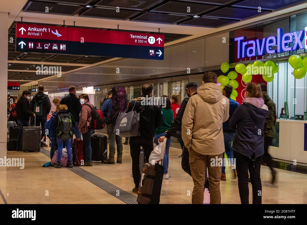 Schönefeld, Germany - November 1, 2020 - Travelers stand in line at a Covid-19 test center at Berlin-Brandenburg Airport (BER) Stock Photo