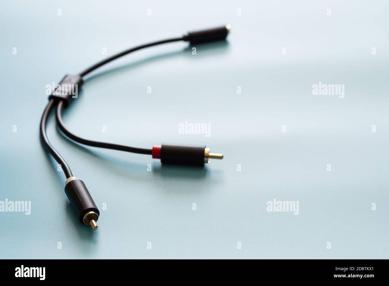 AV splitter cable connector and copy space on blue background color