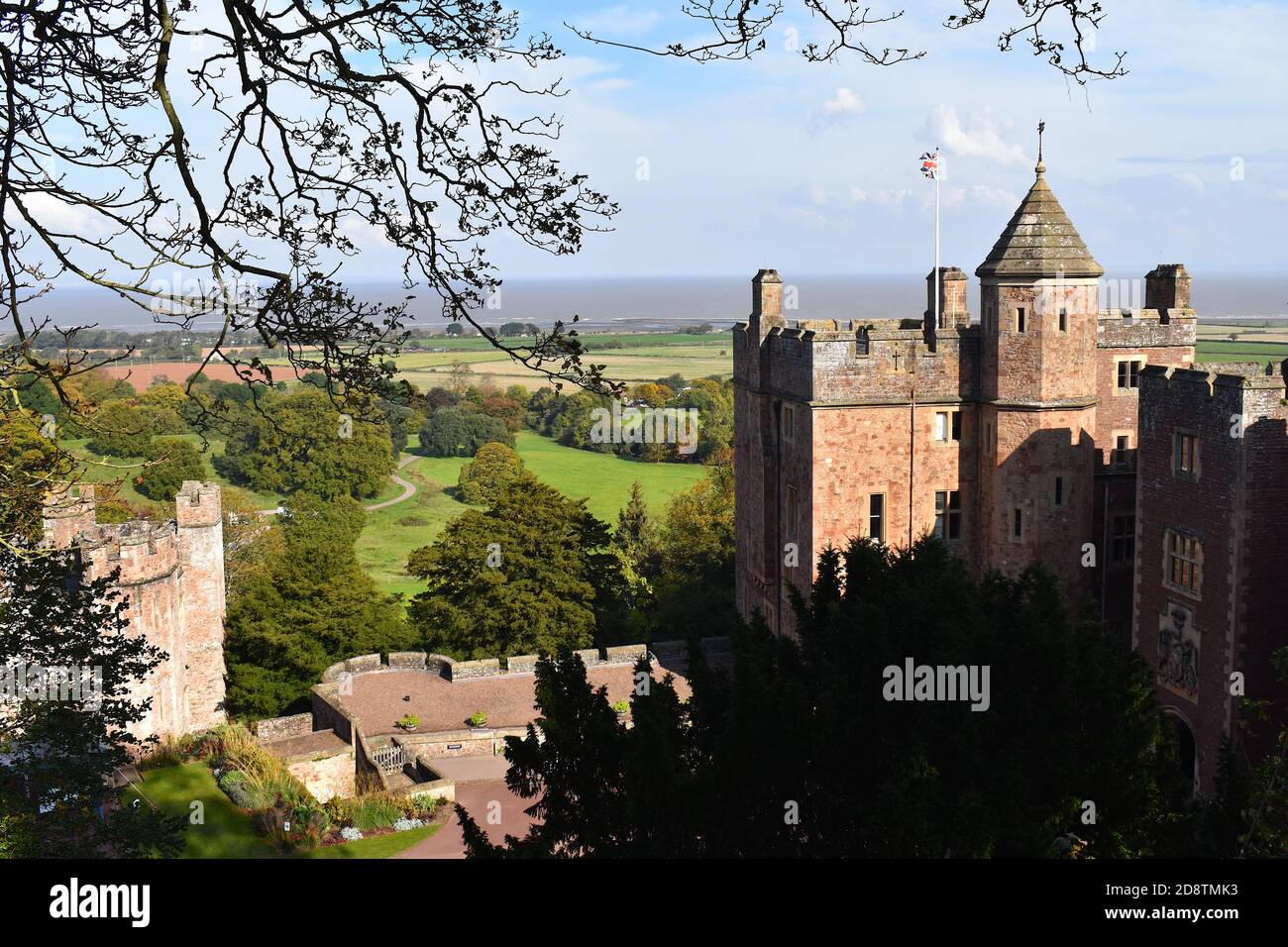 Fortified castle on a hilltop home of the Luttrells remodelled in 