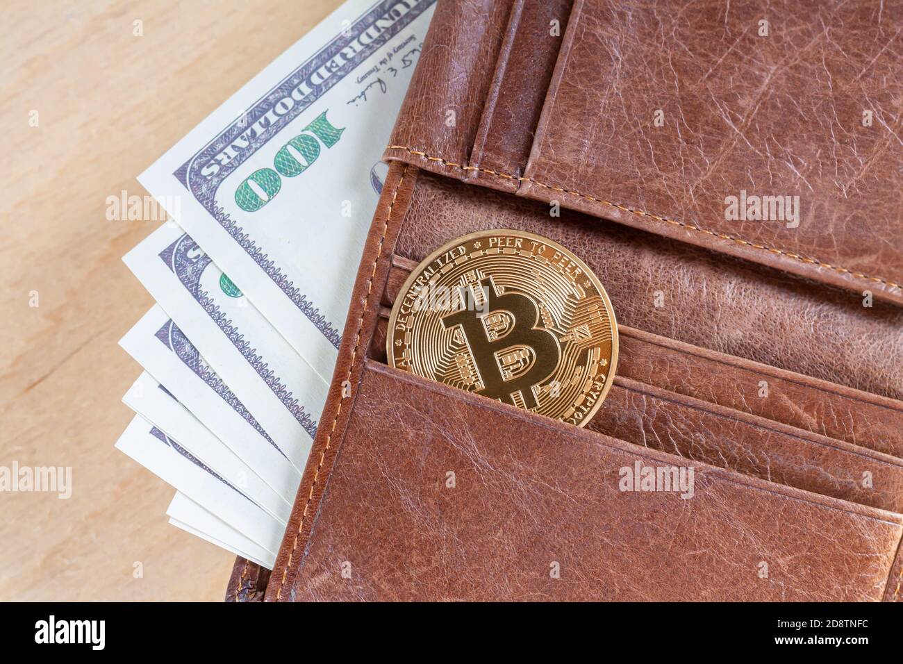 Bitcoin with paper dollars in wallet top view. Virtual cryptocurrency  trading and investment concept Stock Photo - Alamy