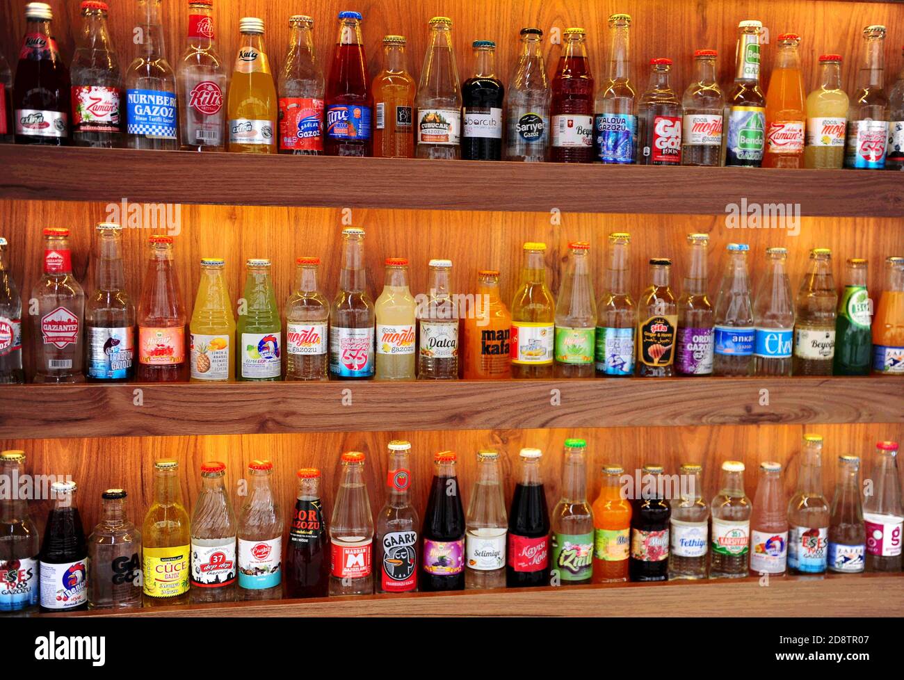 Oludeniz,Turkey,19.10.2020: Many interesting jars with different soda are on wooden shelves. Stock Photo
