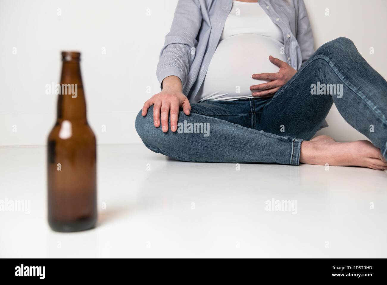 Pregnant women drinking beer on studio white Stock Photo Alamy