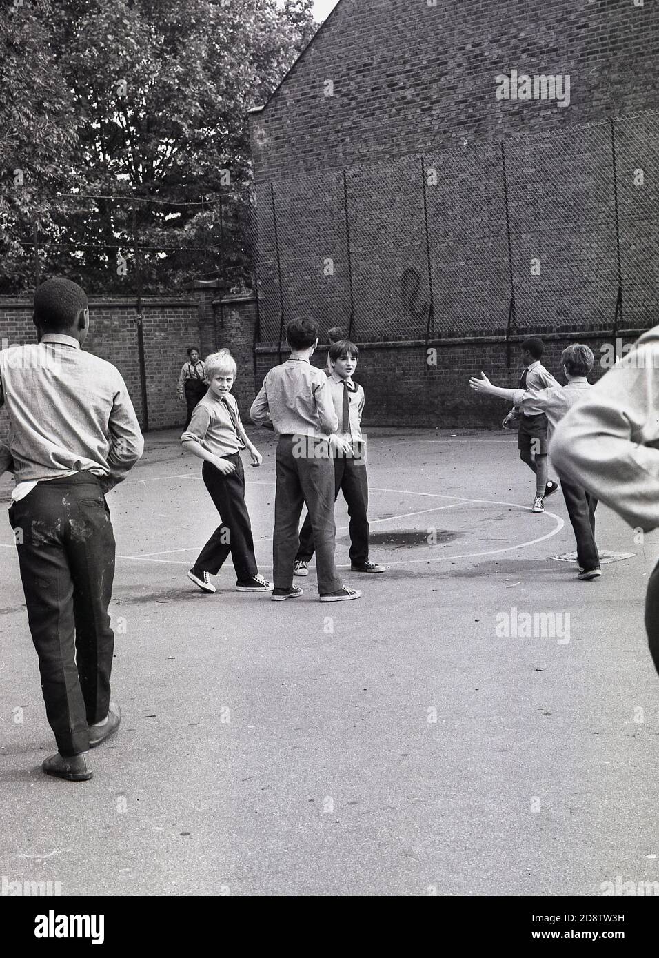1960s, historical, schoolboys at an inner London state boys boarding school outside in the playground. Stock Photo