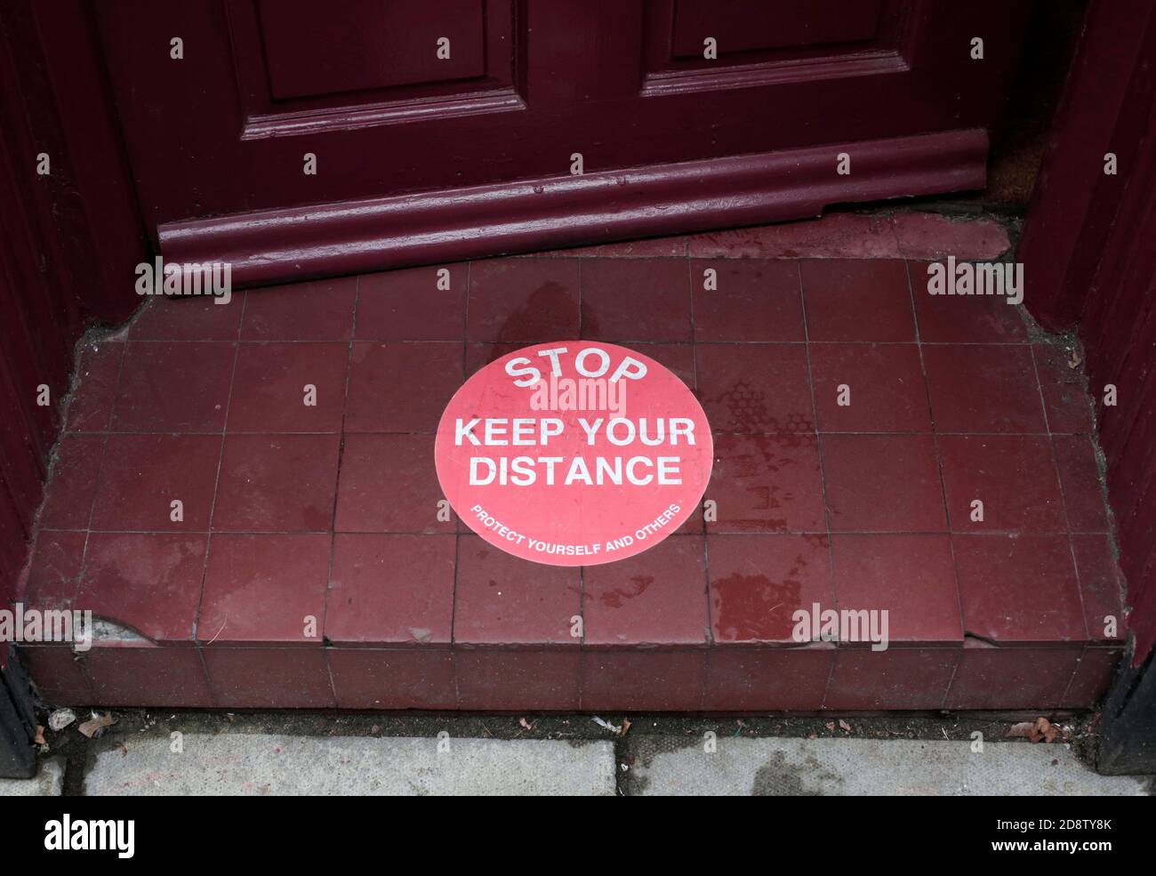 A Covid-19 sign in a shop doorway, Darlington, County Durham, UK. 30/10/2020. Photograph: Stuart Boulton Stock Photo