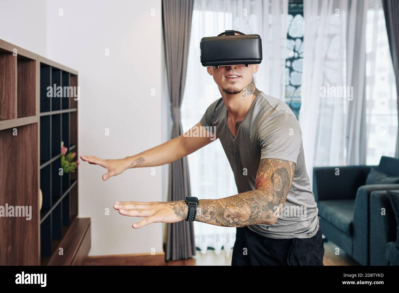 Excited man in VR glasses Stock Photo