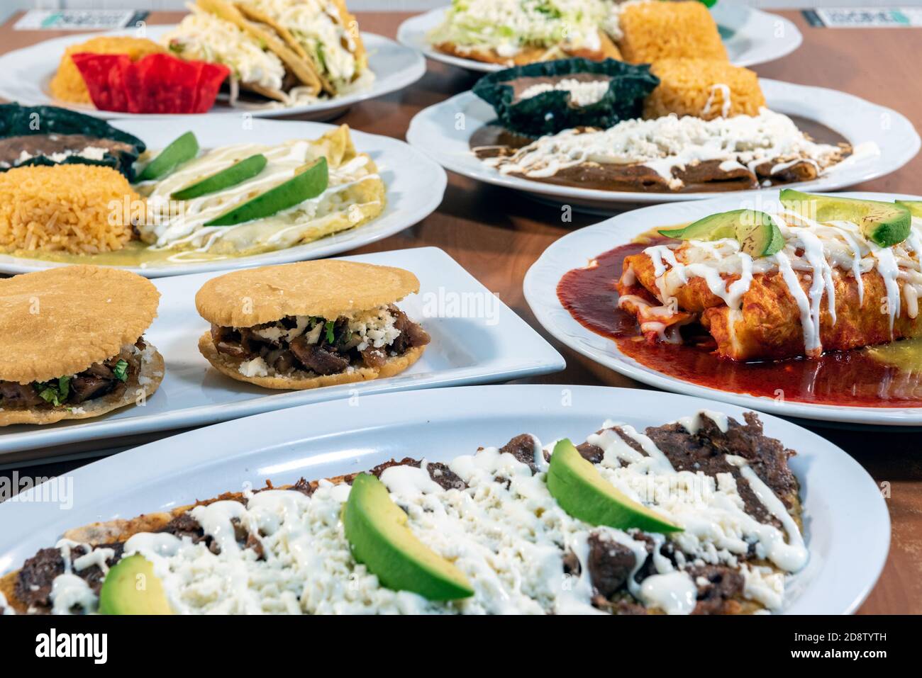 Buffet table of authentic Mexican food plates with several different flavors and styles to choose from. Stock Photo