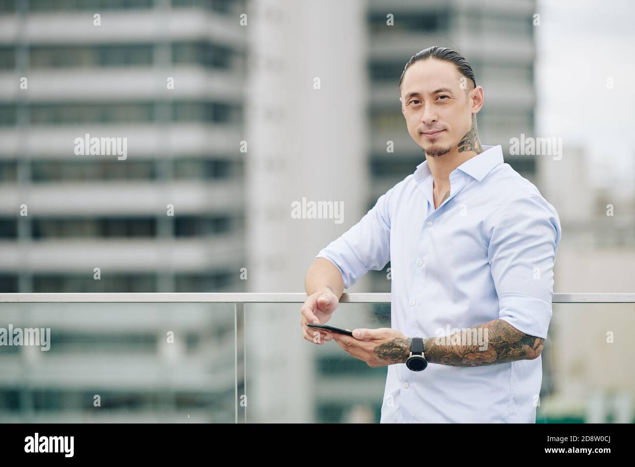 Handsome man with smartphone Stock Photo