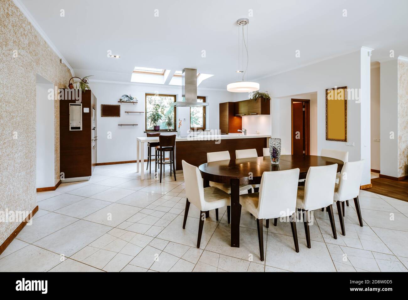 Contemporary interior of spacious kitchen in luxury apartment. Wooden