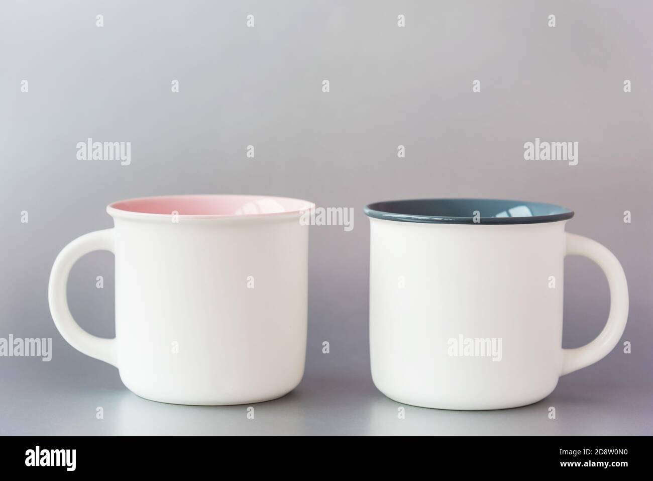 Elegant cups with mockup for design on light grey background Stock Photo
