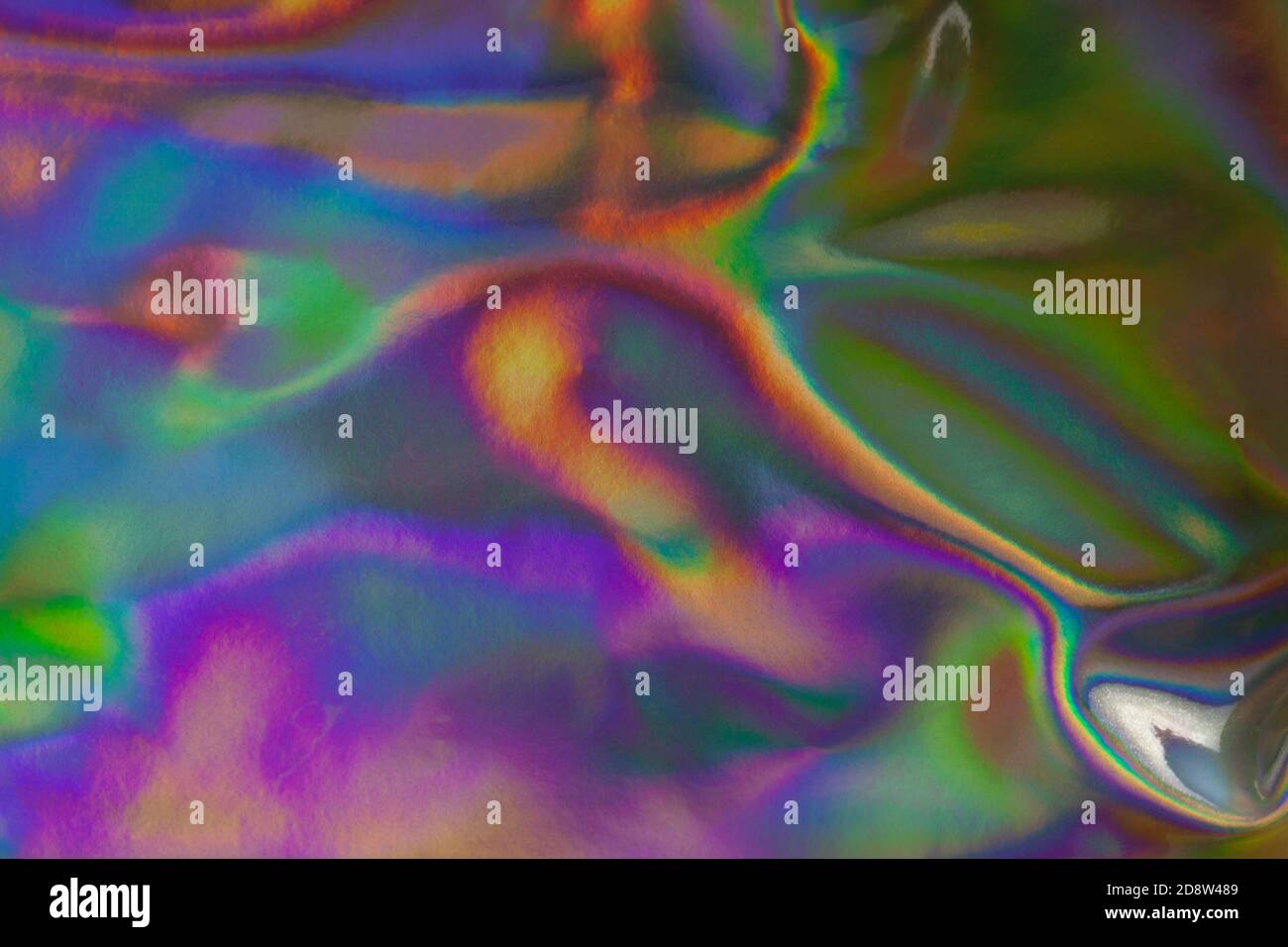 Abstract textured holographic background from leather surface. Trendy multicolor texture with copy space for text. Celebration, holidays, fashion conc Stock Photo