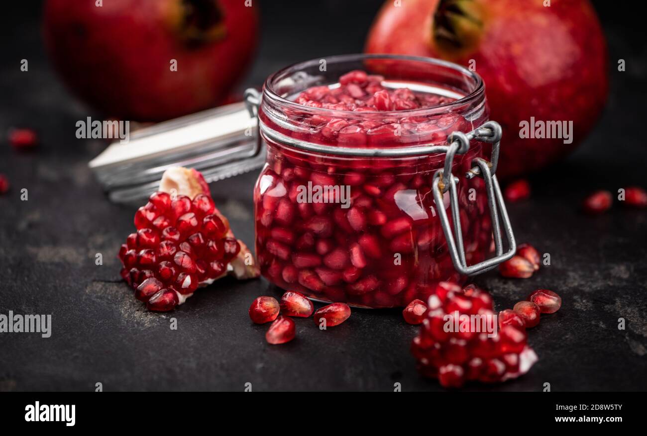 Some fresh preserved Pomegranate seeds (selective focus; close-up shot) Stock Photo