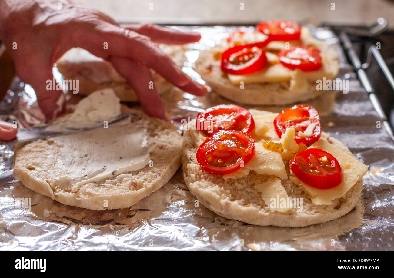 Soda Bread with cheese and tomato being grilled Stock Photo
