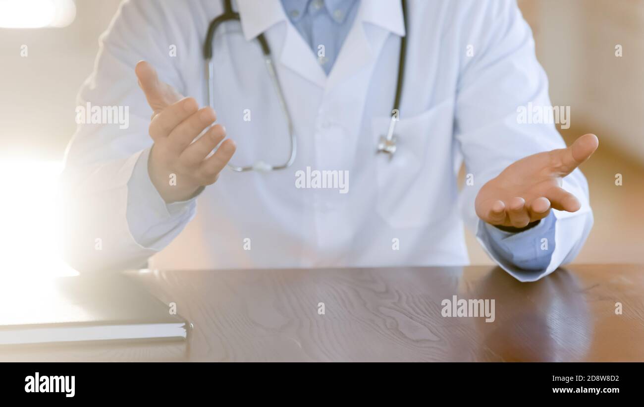 Closeup of male doctor explaining patient diagnosis or treatment details Stock Photo