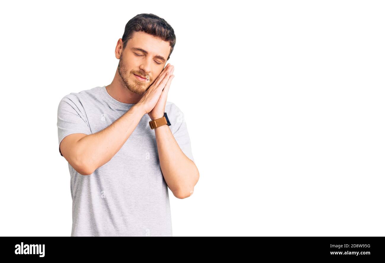 Handsome young man with bear wearing casual tshirt sleeping tired ...