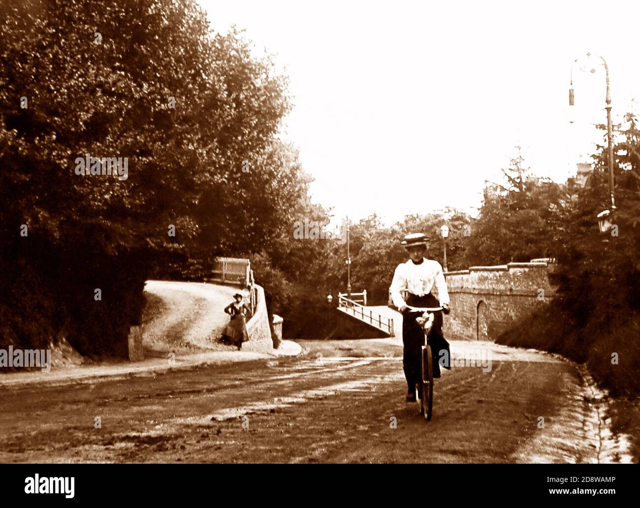 Lady cycling up Castle Hill, Maidenhead, Victorian period Stock Photo