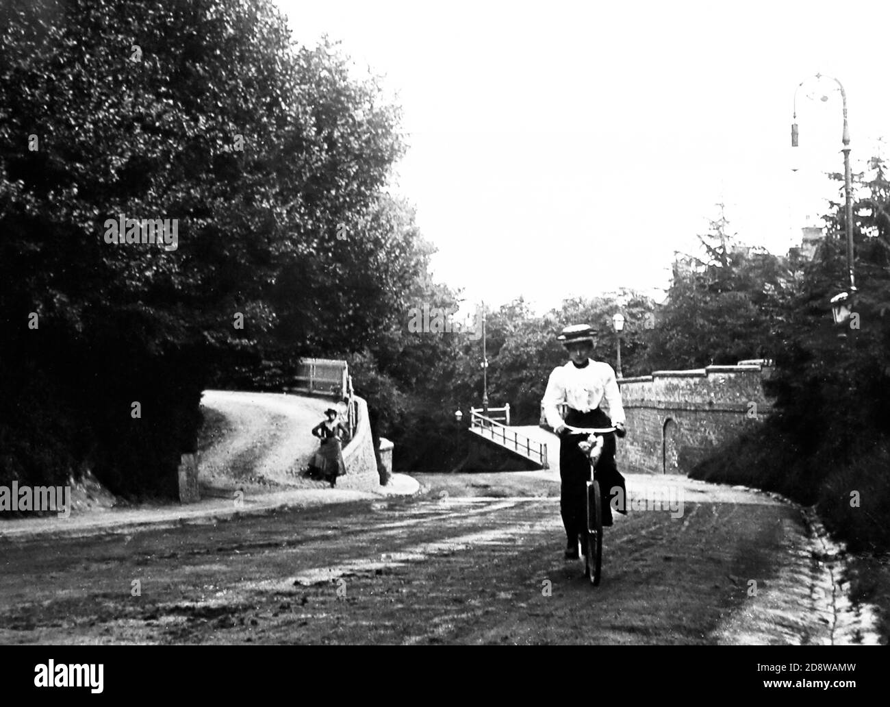 Lady cycling up Castle Hill, Maidenhead, Victorian period Stock Photo