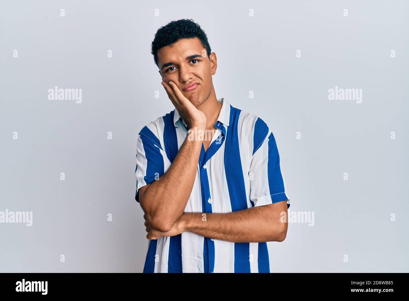 Young arab man wearing casual clothes thinking looking tired and bored ...