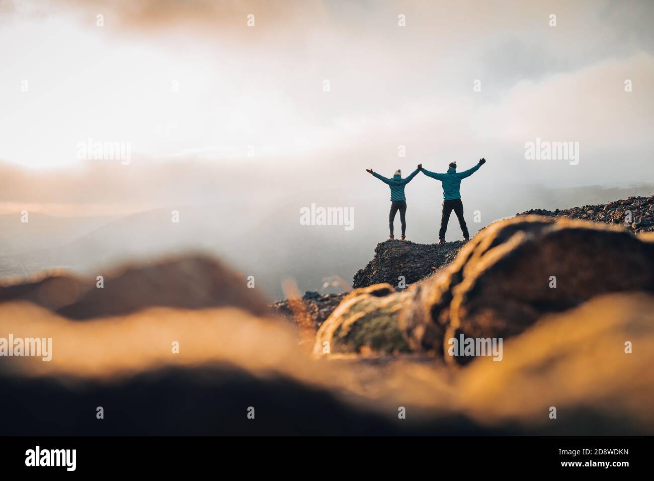 Couple travelers Man and Woman standing on cliff relaxing mountains and ...