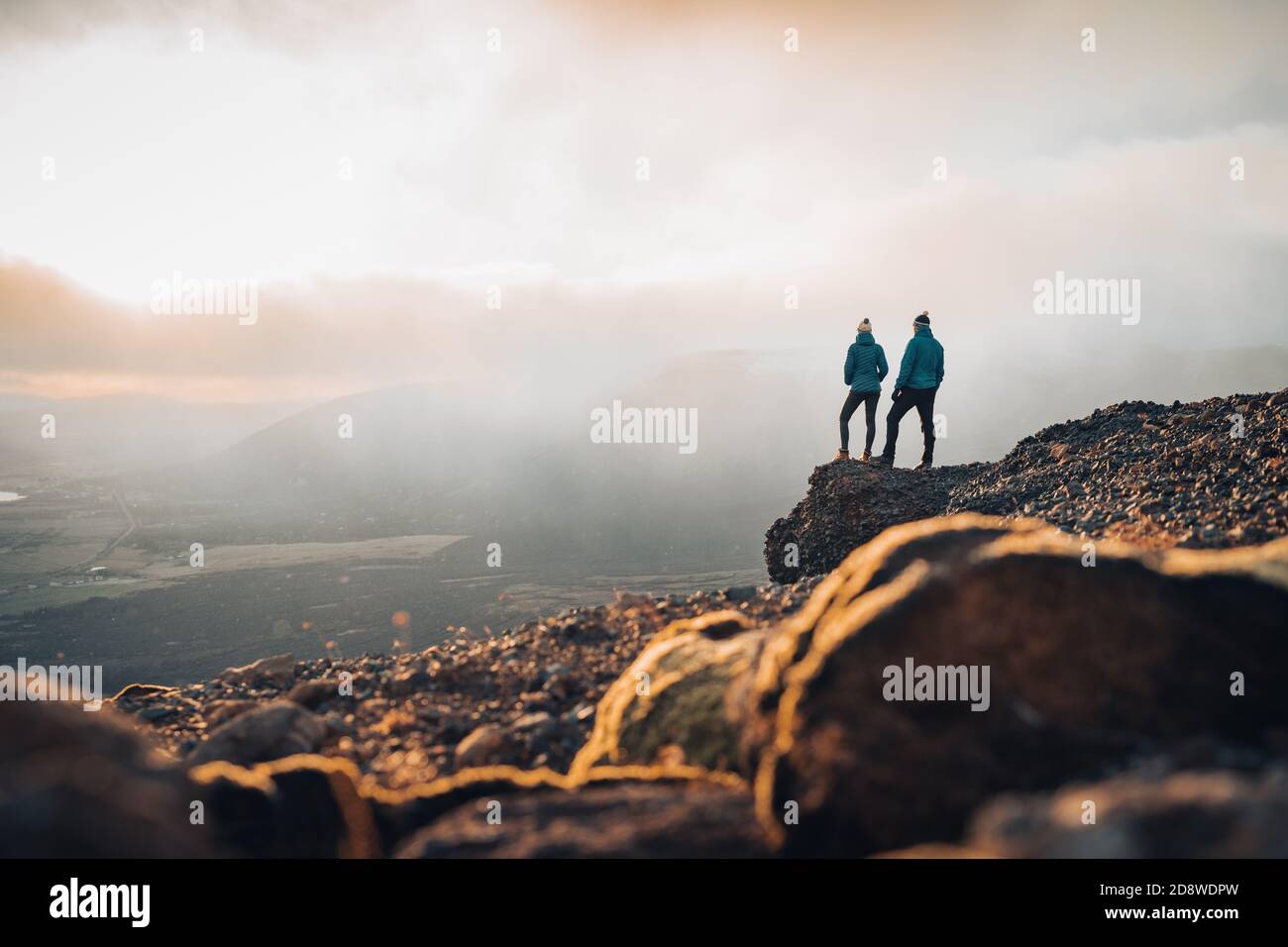 Couple travelers Man and Woman standing on cliff relaxing mountains and ...