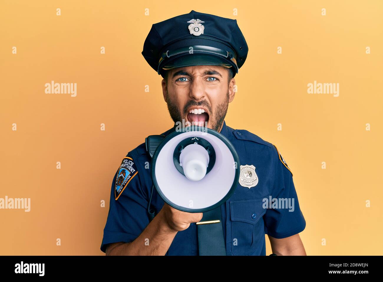 American police officer shouting through megaphone, yelling and ...