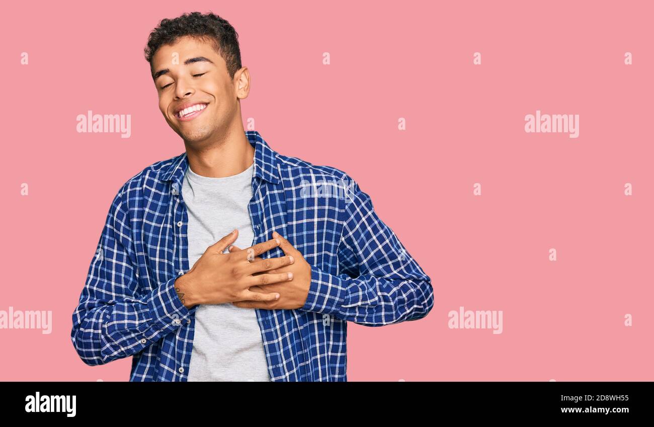 Young handsome african american man wearing casual clothes smiling with ...