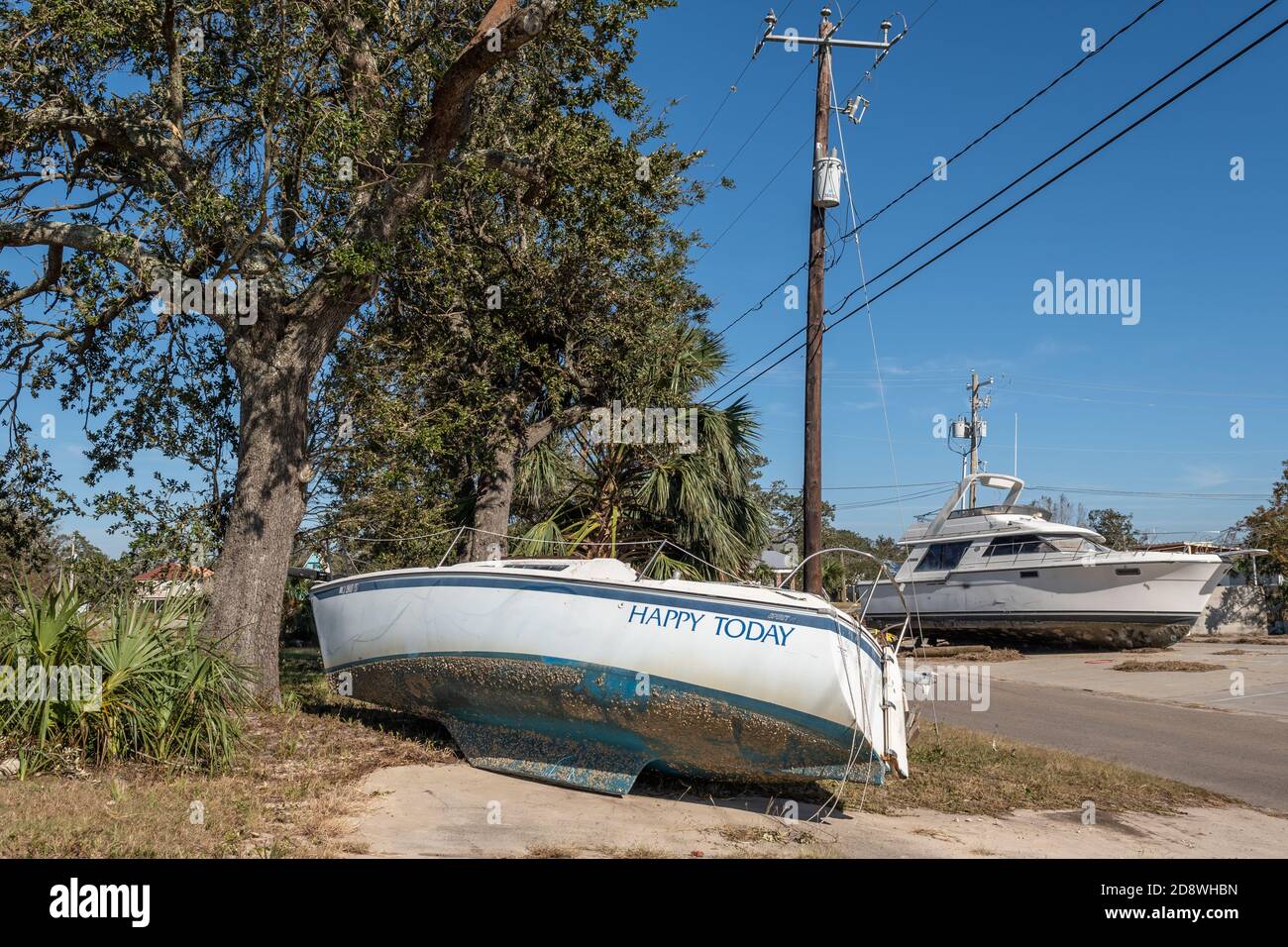 Hurricane Zeta storm surge pushed boats from Long Beach Harbor across Highway 90 on the Mississippi Gulf Coast. Stock Photo