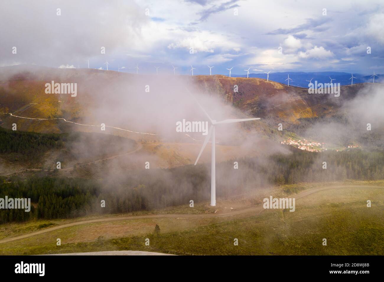 Wind turbines drone aerial view renewable energy on the middle of clouds in Serra da Lousa, Portugal Stock Photo