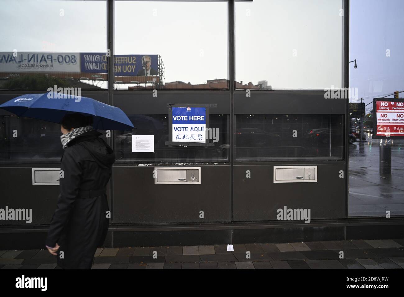 Brooklyn, New York 1 November 2020 A woman enters polling place line outside Barclay’s Center on a rainy Sunday in the last minutes of early voting in the 2020 presidential campaign. Credit: Joseph Reid/Alamy Live News Stock Photo