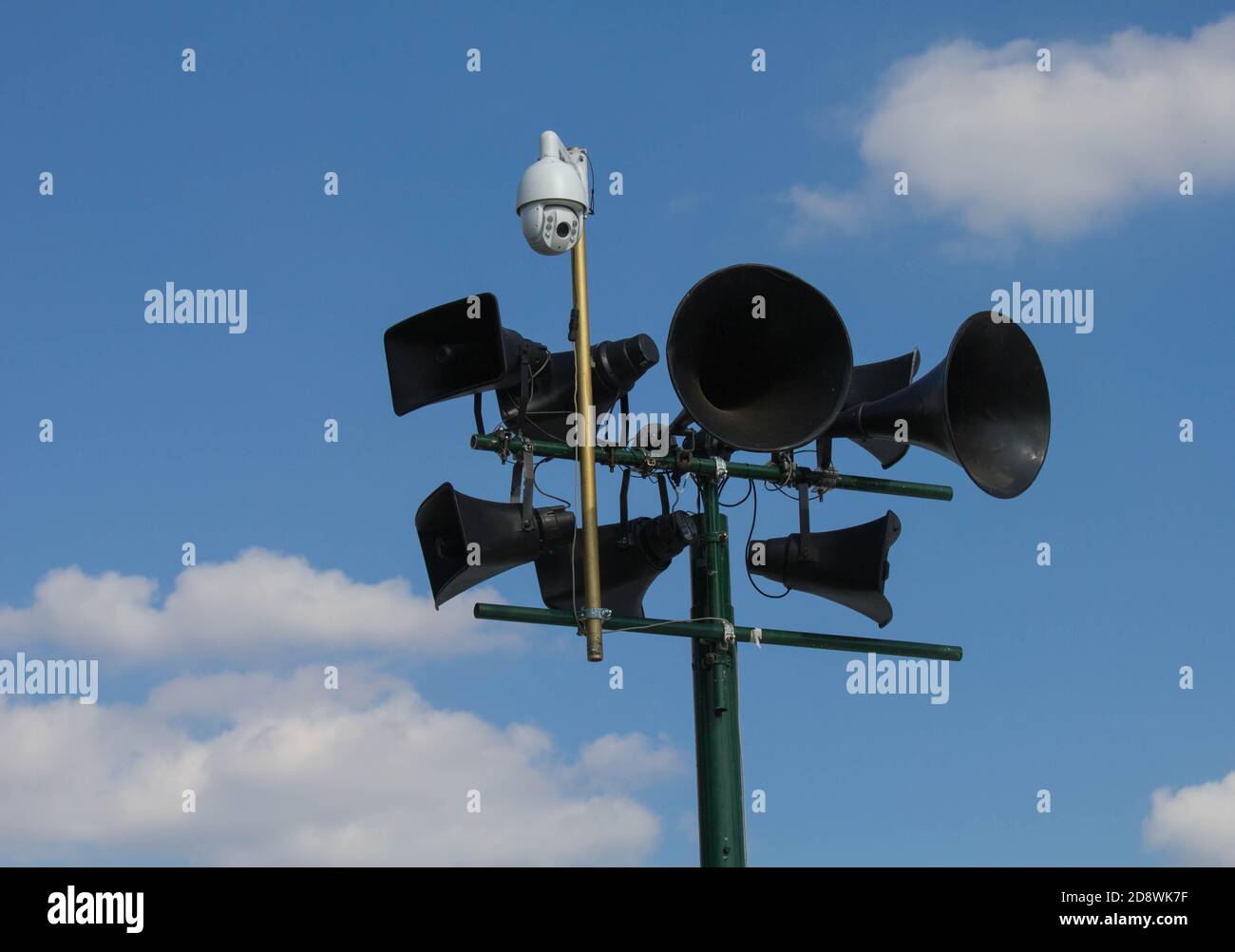 Tannoy system and surveillance camera against a blue sky Stock Photo
