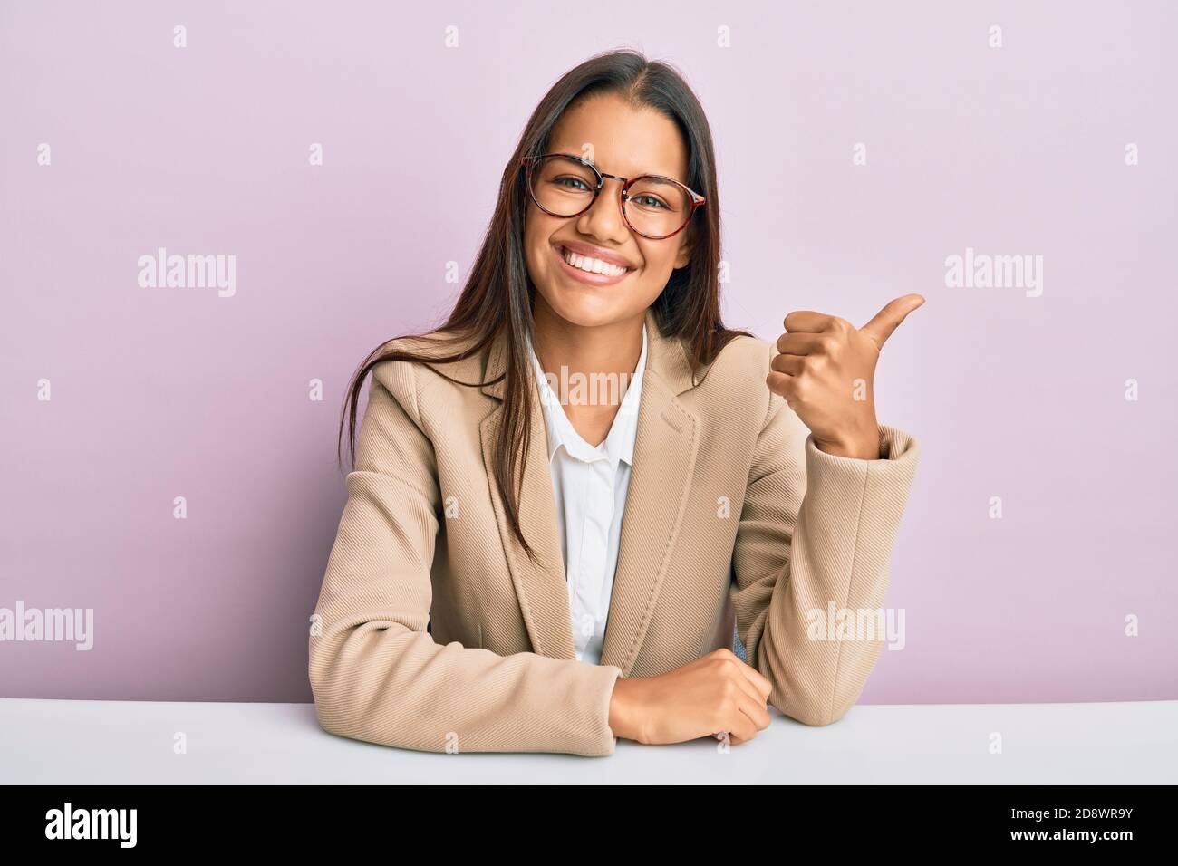 Beautiful hispanic woman working at the office smiling with happy face ...