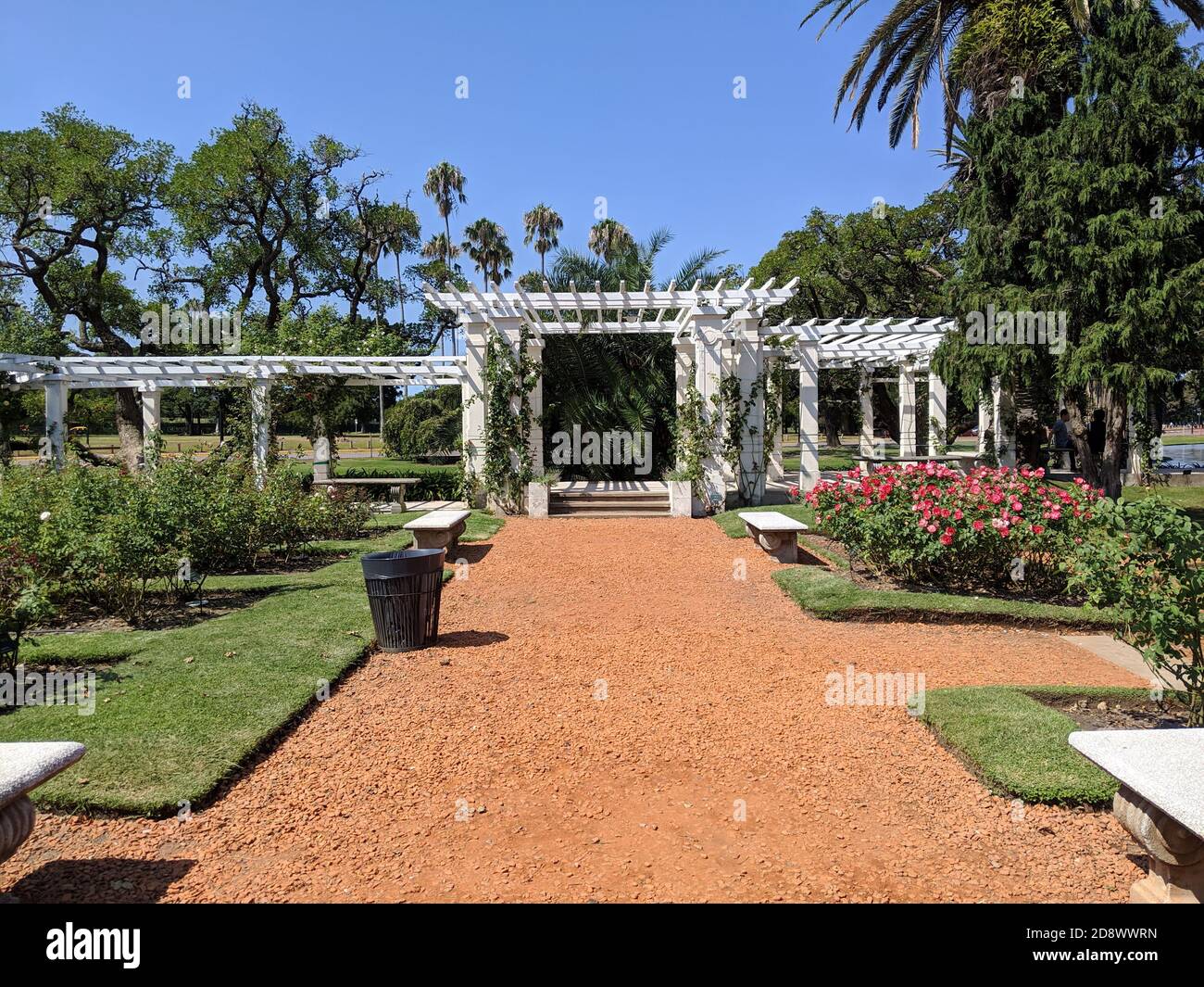 Parque Tres de Febrero, known as Bosques de Palermo in Buenos Aires, Argentina. Urban park, garden with shaded walkway, roses, trees and benches Stock Photo