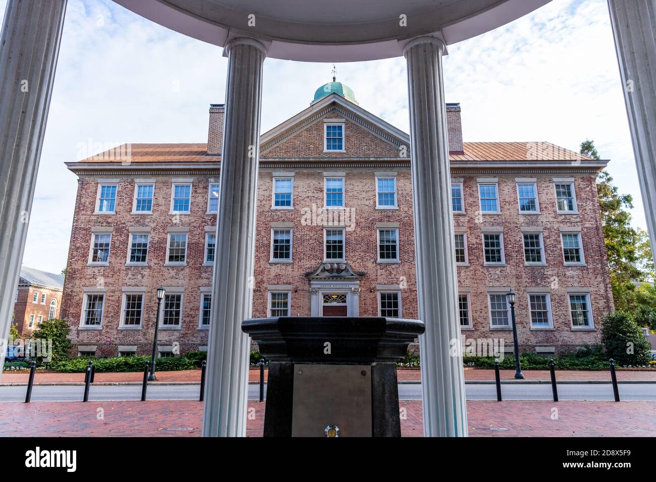 Chapel Hill, NC / USA - October 22, 2020: Looking thru The Old Well to see The South Building on the campus of the University of North Carolina, UNC. Stock Photo