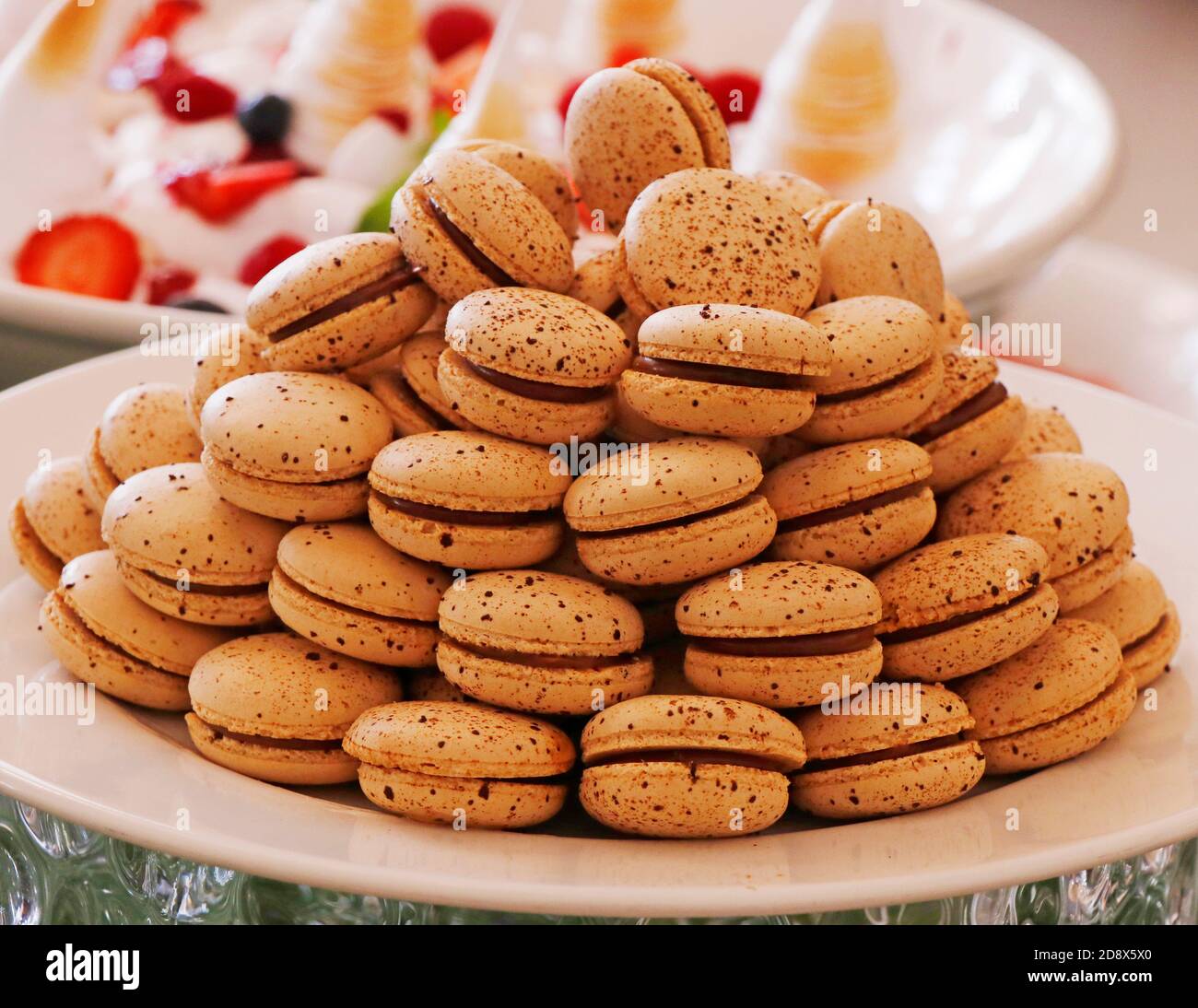 macarons or macaroons stacked in a plate french sweet speciality Stock ...