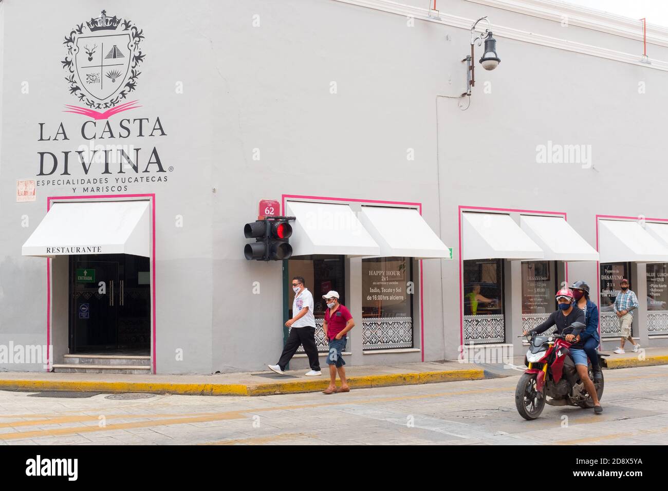 People walking in a mostly empty downtown Merida during the Covid19 Pandemic, November 2020 - Many shops being closed and many businesses went out of business because of the Coronavirus restrictions. Merida, Yucatan, Mexico Stock Photo