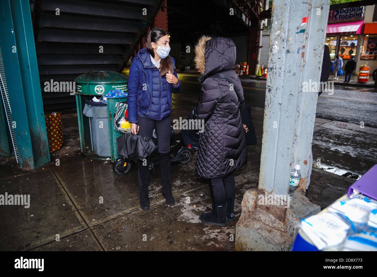 US Congresswoman Alexandra Ocasio-Cortez wearing a face mask informs ...