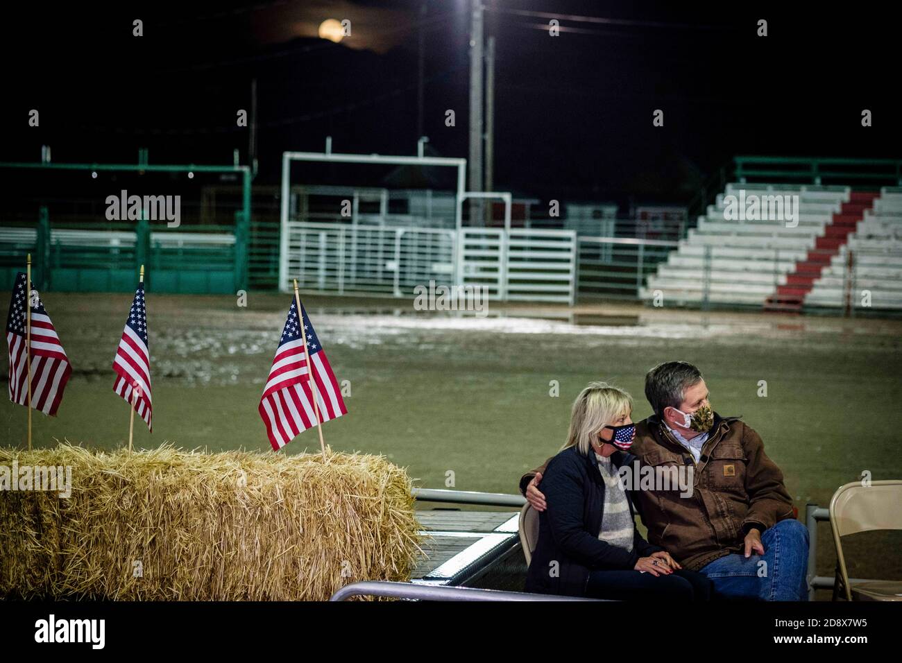 Kalispell, Montana, USA. 31st Oct, 2020. Montana Senator Steve Daines and his wife Cindy on stage at a Get Out The Vote Rally on Halloween night as a full blue moon came up at the Flathead County Fairgrounds in Kalispell, Montana.Incumbent Senator Daines is in a tight with Montana Governor Steve Bullock. Credit: Kent Meireis/ZUMA Wire/Alamy Live News Stock Photo