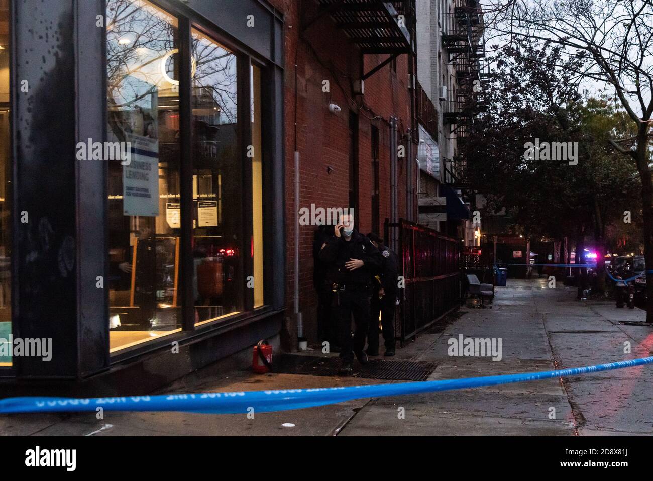 Brooklyn, United States Of America . 01st Nov, 2020. NYPD officers of the 78th Precinct secure the crime scene after a man was shot at a house party inside the basement of a building on the corner of Union Street and Fifth Avenue in the Park Slope neighborhood of Brooklyn, New York, on November 1, 2020. According to the NYPD, they are looking for two perpetrators who shot the victim multiple times during an apparent robbery attempt. (Photo by Gabriele Holtermann/Sipa USA) Credit: Sipa USA/Alamy Live News Stock Photo