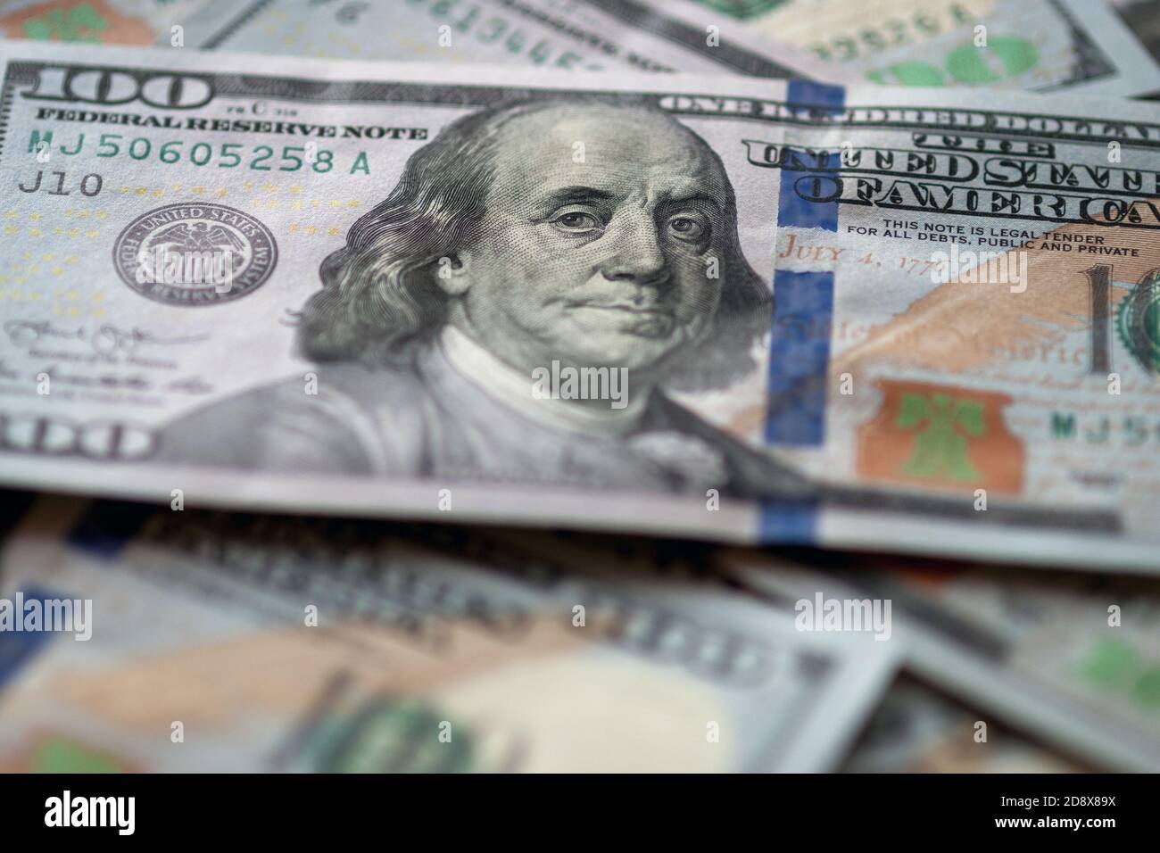 US fiat money pile, hundred dollar bills with Franklin closeup Stock Photo