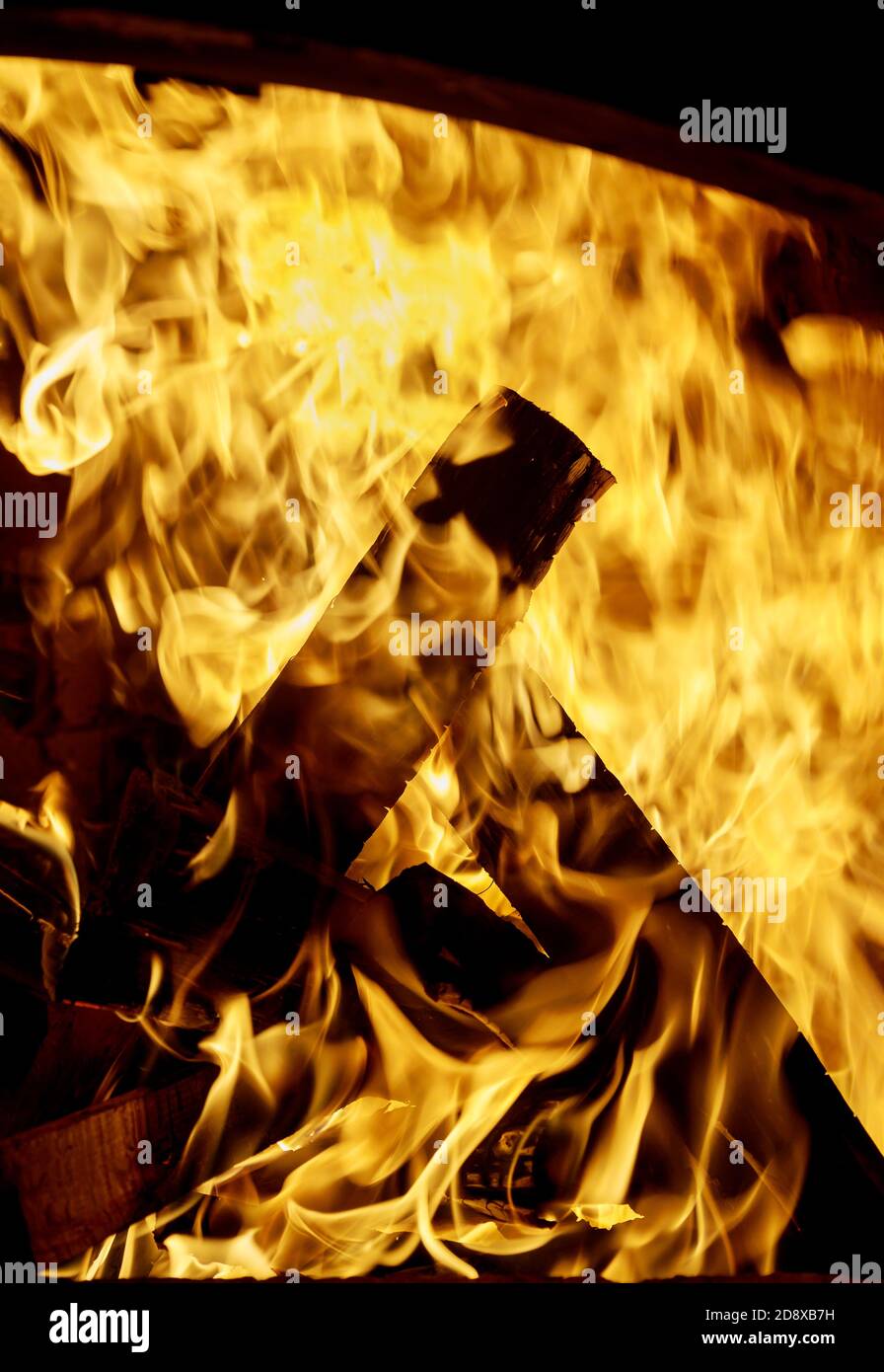 Close up of flames burning in the fireplace burning fire, firewood Stock Photo