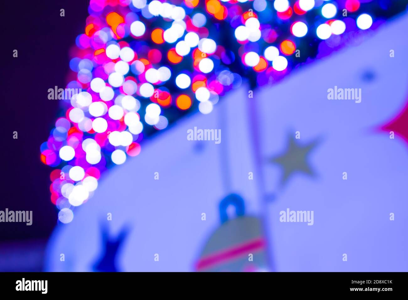 Christmas tree lights in the square, unfocused background Stock Photo