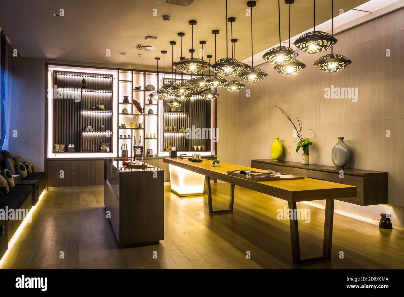 the waiting room lobby reception of a spa with couches, lighting and