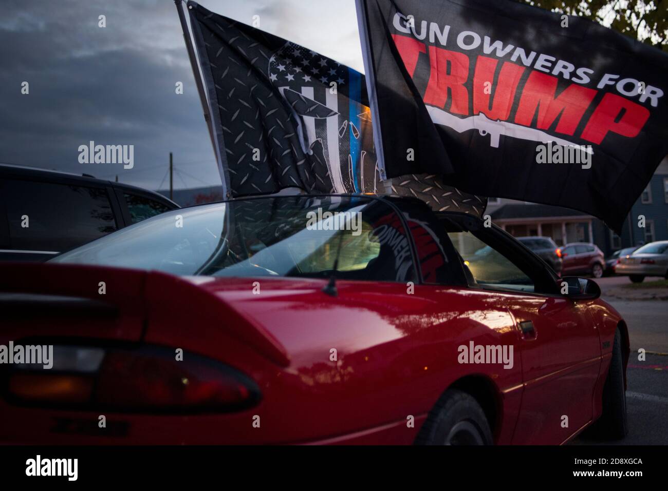 Montoursville, Lycoming County Pennsylvania, USA. 31 October 2020. Sports car displays Trump Second Amendment flag, and Blue Lives Matter Flag, at Tru Stock Photo