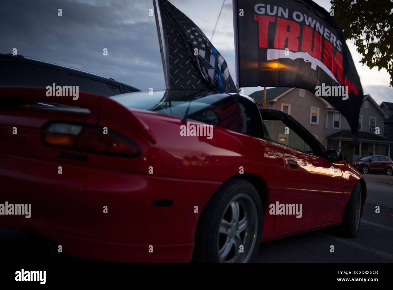 Montoursville, Lycoming County Pennsylvania, USA. 31 October 2020. Sports car displays Trump Second Amendment flag, and Blue Lives Matter Flag, at Tru Stock Photo