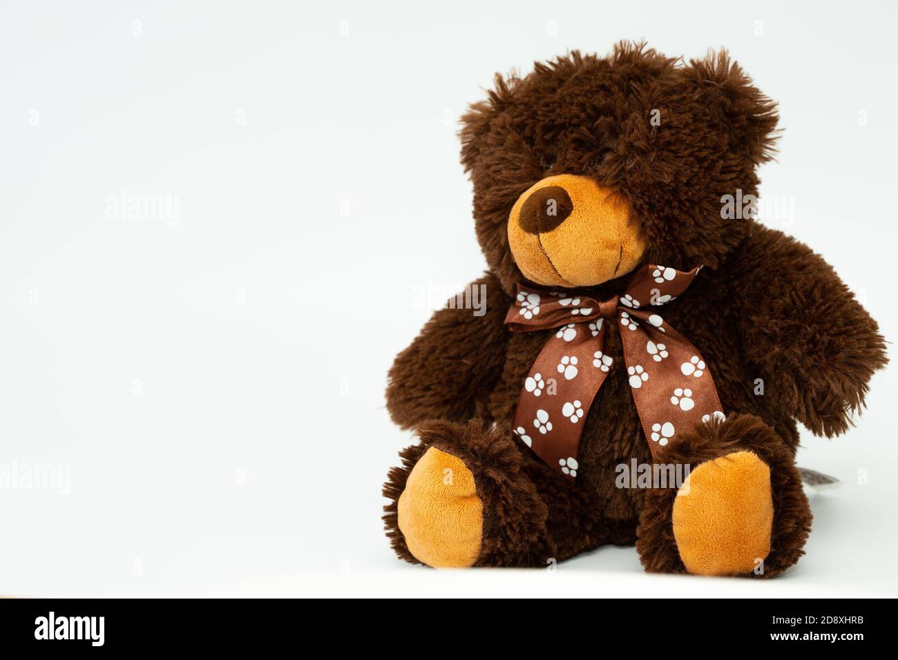 A brown teddy bear toy isolated on the white background. Stock Photo
