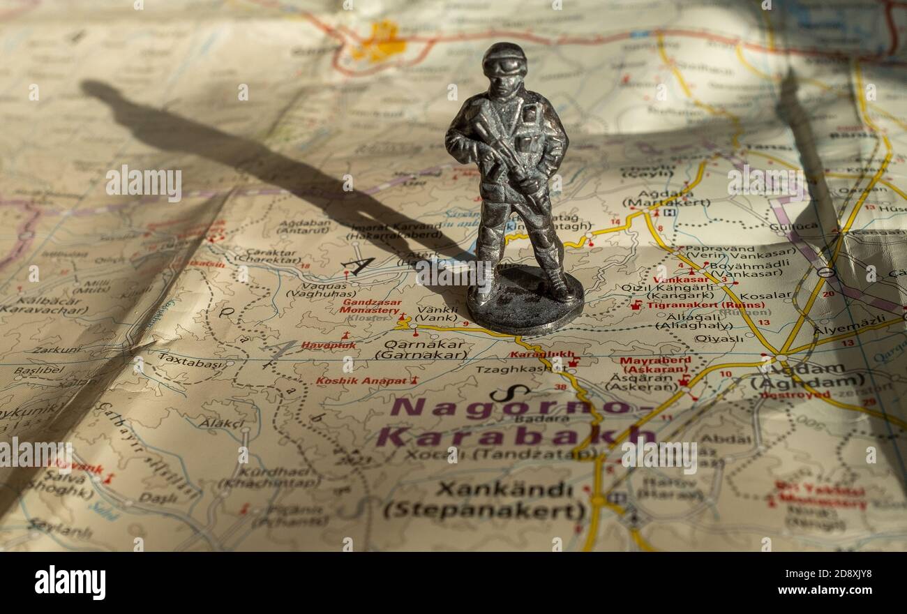 A figurine of an armed soldier on the map of Nagorno-Karabakh. Stock Photo