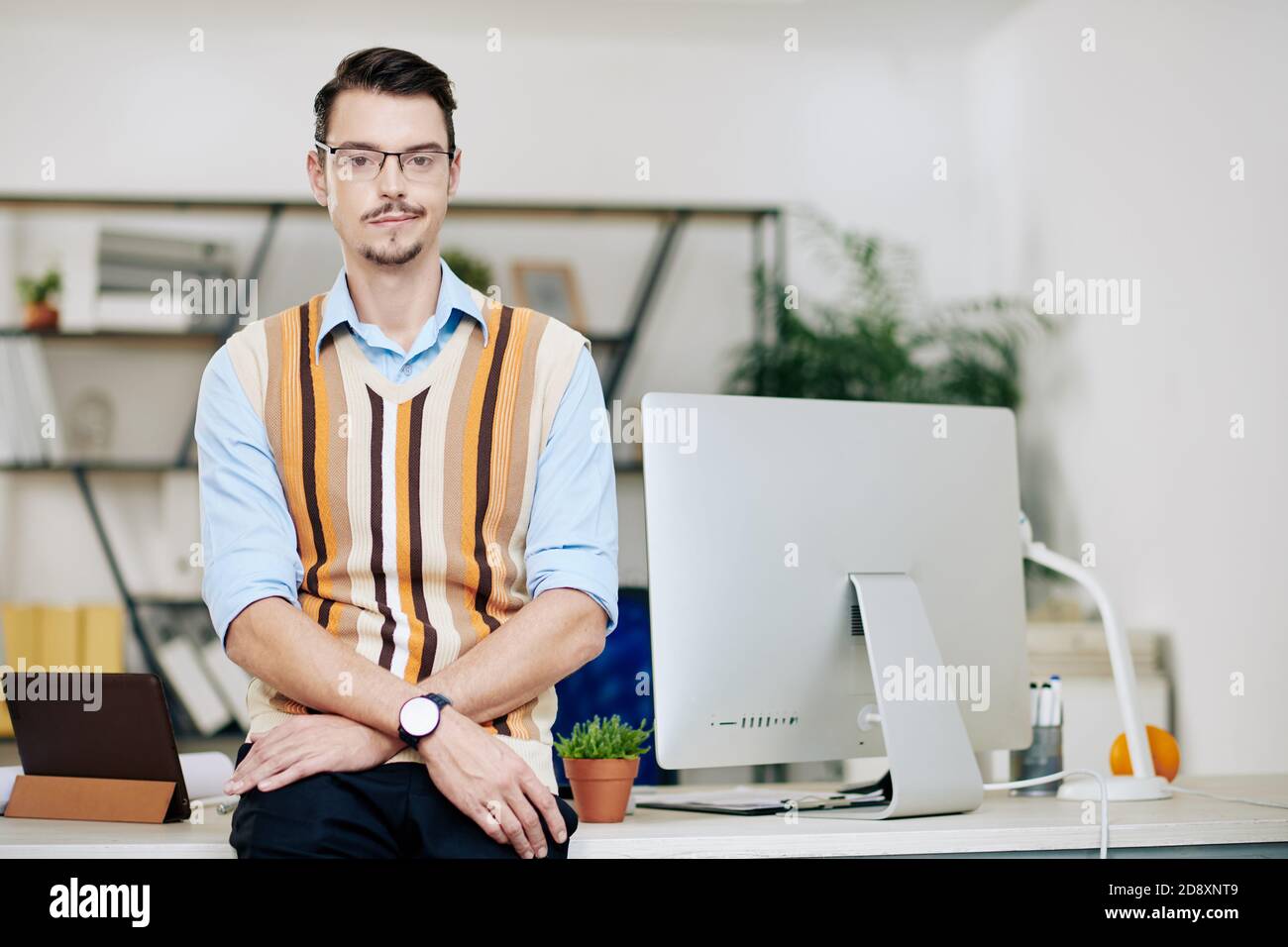 Smiling young computer engineer Stock Photo