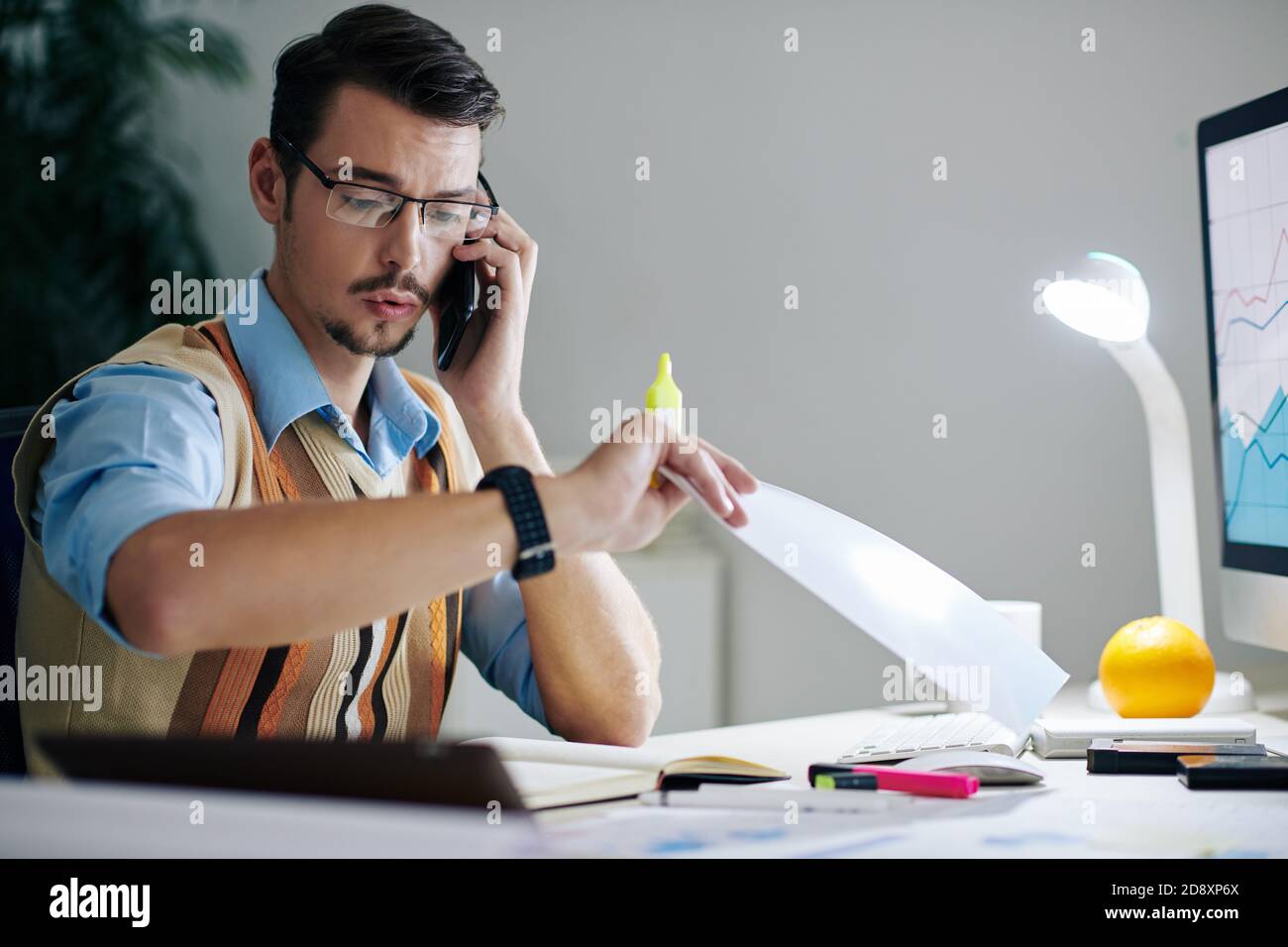 Surprised businessman checking time Stock Photo