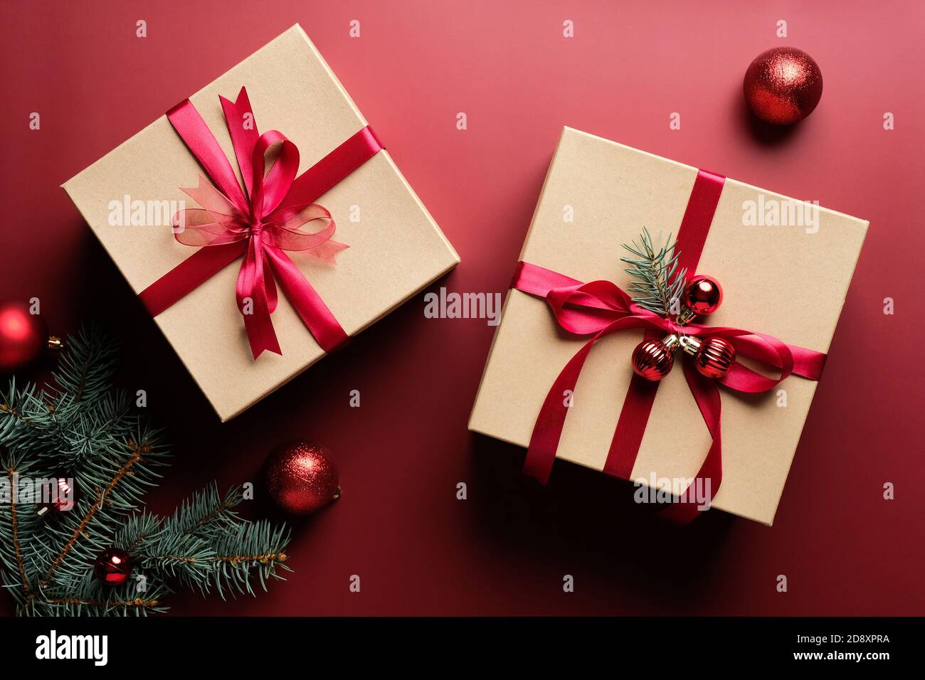 Luxury Christmas gifts, fir branches and balls decoration on marsala