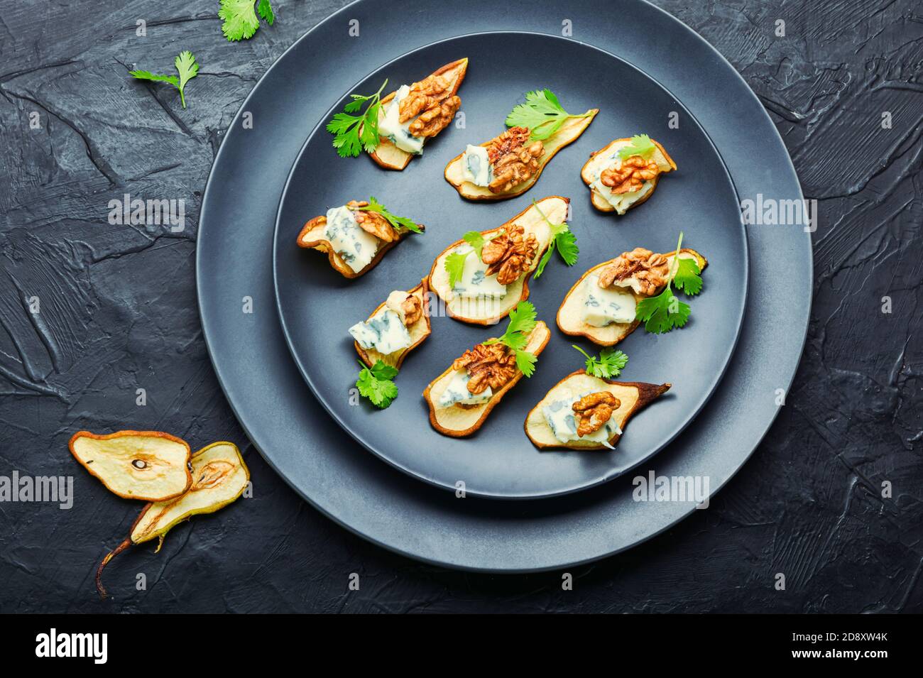 Dry pear,blue cheese and walnut appetizer.Sliced dried pear pieces
